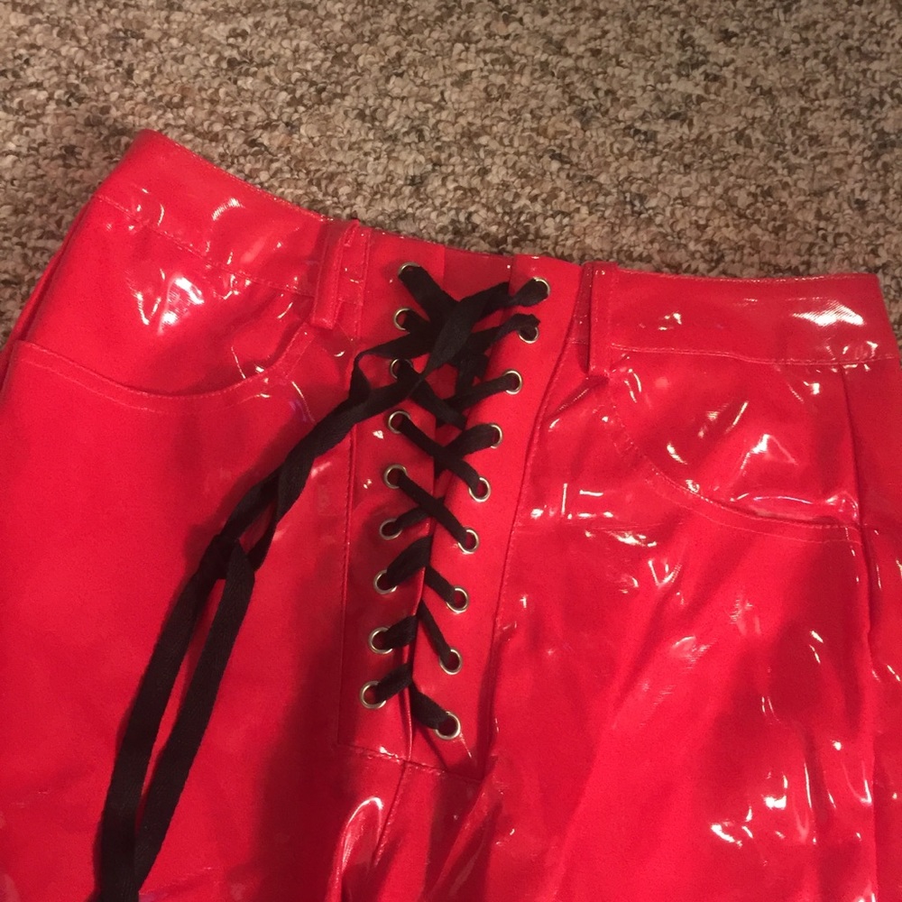 Red vinyl faux latex faux leather lace up pants